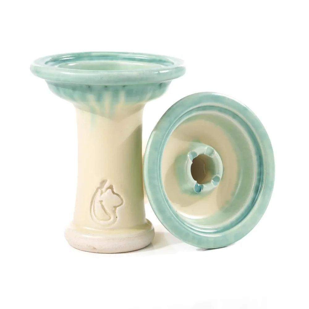 Dschinni Shisha Phunnel Royal Schamottstein Verde in hellblau/türkis. Es ist ein stehender und ein liegender Phunnel abgebildet. Das Dschinni Symbol ist zu sehen.